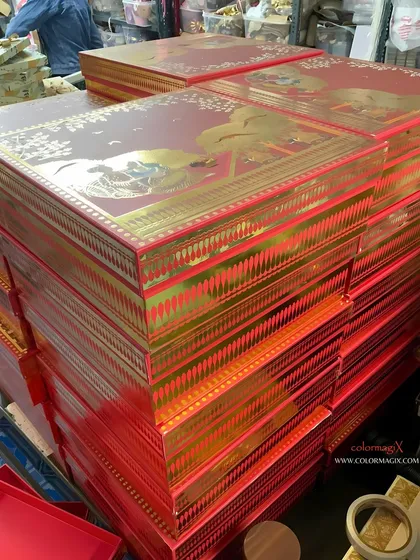 A stack of our magnificent red and gold wedding boxes. The intricate traditional design makes them a grand statement for presenting wedding sweets or other gifts.