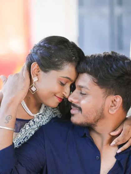 A beautiful, intimate close-up of a couple. This shot is all about their connection and the subtle details of their pre-wedding look.