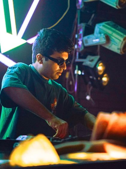 In the zone with my sunglasses on. This is me, focused on the mix and the music.