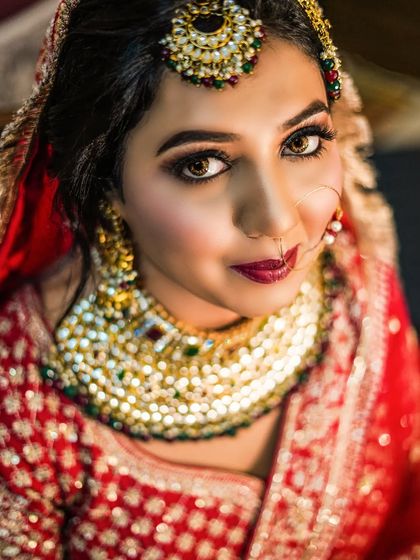 A close-up bridal portrait focusing on her expressive eyes and flawless makeup. This shot is all about capturing the beauty and anticipation that shines from within.