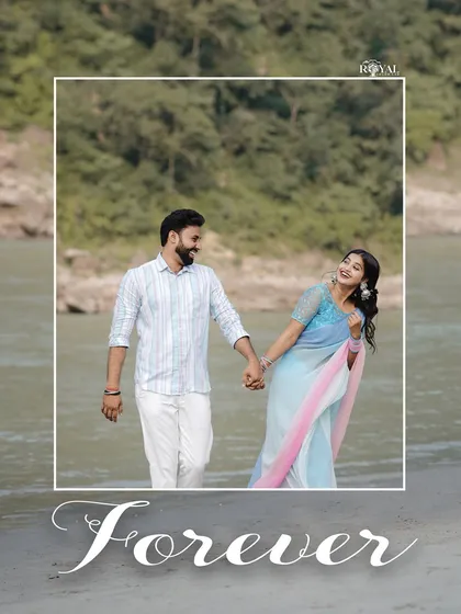 A happy, candid shot of a couple walking hand-in-hand by the river, with the word 'Forever' elegantly scripted.