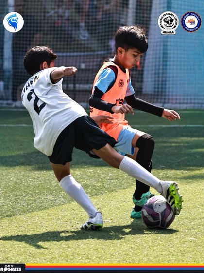 A perfectly executed tackle. Our players are taught the importance of timing and technique in winning the ball back.
