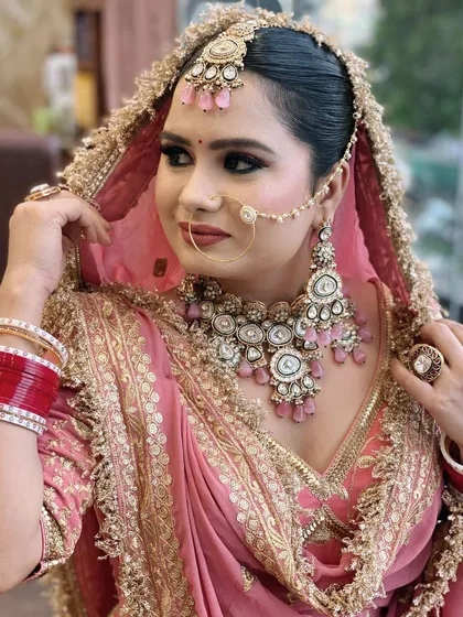 A portrait shot capturing the bride's gentle expression. The makeup highlights her best features without being overpowering, creating a look of pure elegance.