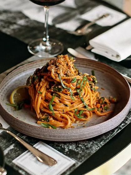 A hot plate of spaghetti is the perfect Sunday dinner. This image captures the rich, comforting appeal of our pasta dishes, perfect for a cozy night in.