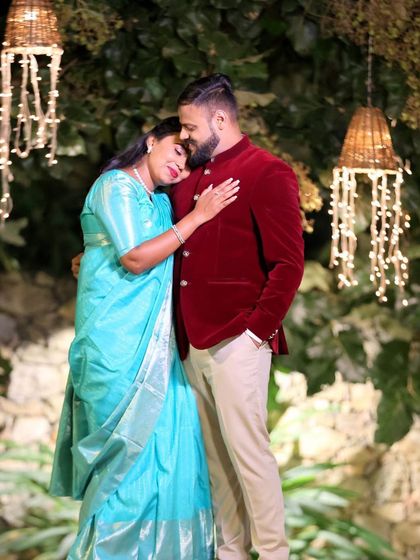 A romantic shot of Simran and her partner at their ring ceremony. Her makeup looks flawless and timeless in the evening light.