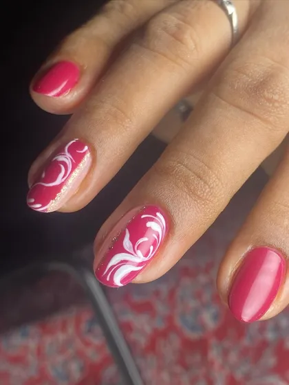The swirl art on these nails is completely hand-drawn for a unique touch.