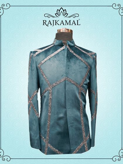 A stylized shot of the teal velvet jacket, framed to highlight its unique design.