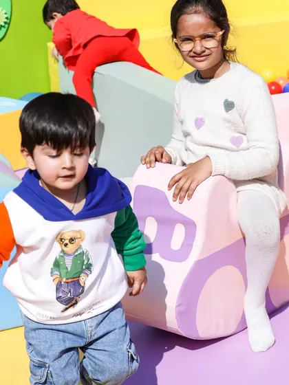 This little boy is enjoying a ride on our soft, safe car rocker inside the play zone.