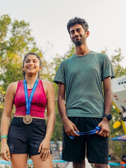 A candid shot of two of the women's category winners. The camaraderie between competitors is one of the best parts of our climbing festivals.