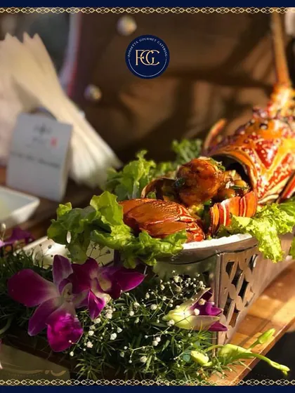 A stunning presentation of grilled lobster, garnished with fresh lettuce and orchids. This premium offering is perfect for adding a touch of opulence to your event.