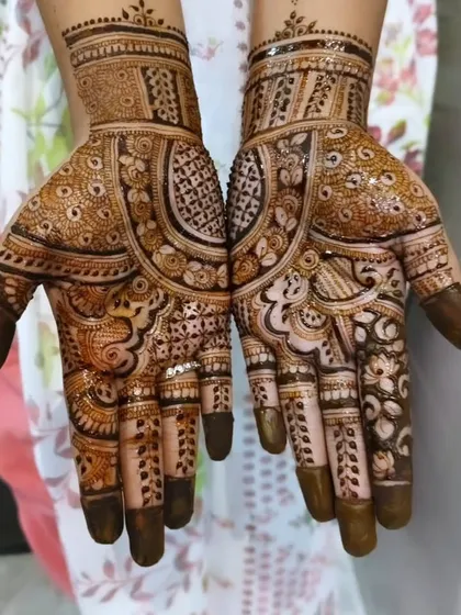 Another shot of the classic peacock bridal mehendi. The symmetry between the two hands is perfect, and the design is dense with beautiful traditional elements.