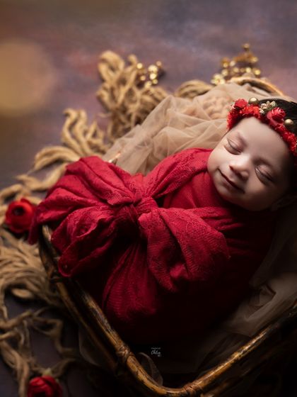 Another take on the red theme, this time with a joyful, sleepy smile. The golden accents in the headband add a touch of festive elegance.