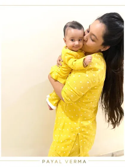 The sweetest moments are often the simplest ones. I designed these cozy, matching yellow polka-dot nightsuits for a mother and her baby, proving that you can celebrate your bond even during a quiet evening at home.