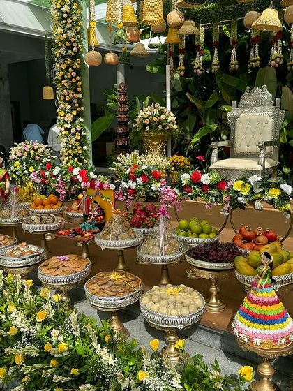 A lush and colorful offering table from a yellow-themed event.