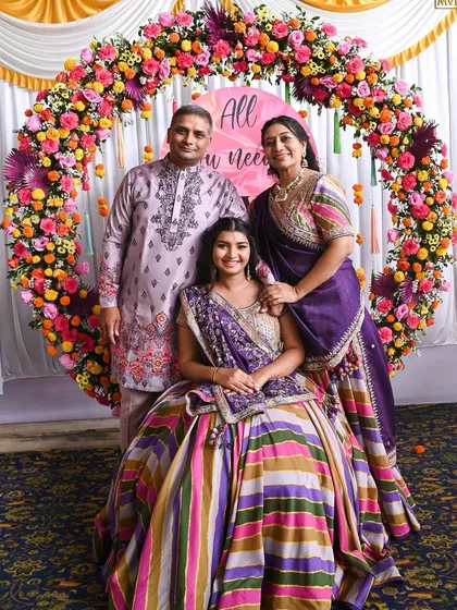 A perfect family portrait. Our floral ring backdrop is a popular choice for creating a focal point for family photos.