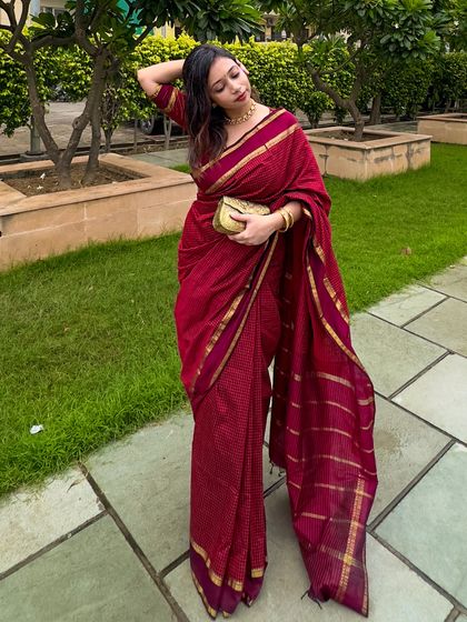 A final pose showing the movement and grace of the saree. This is a perfect example of how to look effortlessly elegant for a family puja or festival.