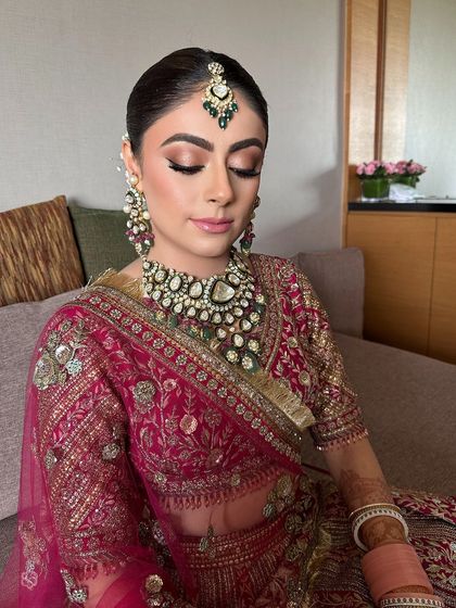 A final look at the bride's flawless makeup and her perfectly styled sleek bun.