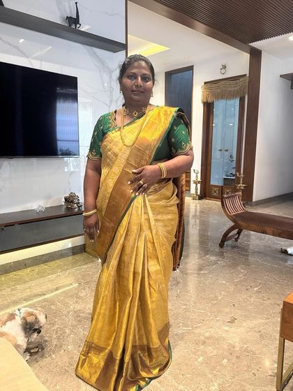 Our gorgeous client Vinuta in a classic gold Kanchipuram silk saree with a contrasting green blouse.