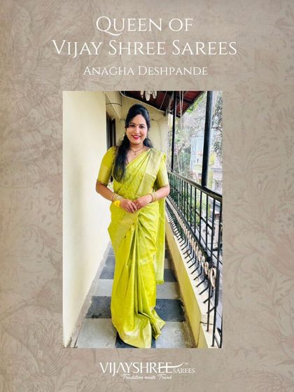A full-length view of Anagha Deshpande in her beautiful lime green Kanjivaram, a perfect choice for festive celebrations.