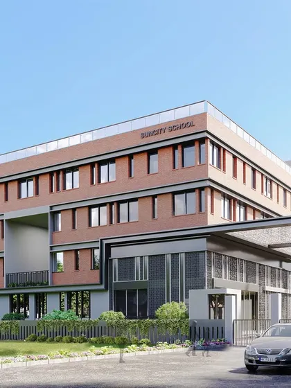 The entrance to the MG Suncity School, another project that emphasizes the connection between education and nature. The design uses a combination of brick, glass, and steel to create a modern yet welcoming institutional building.