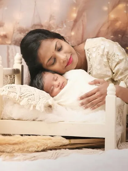 The bond between a mother and her newborn is a story I feel privileged to capture. In our cozy studio, I create a serene and warm environment for these tender moments, focusing on the quiet love and connection.