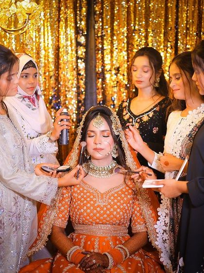 A behind the scenes shot of the makeup artists at work. I coordinate with other vendors to capture these moments without disruption.