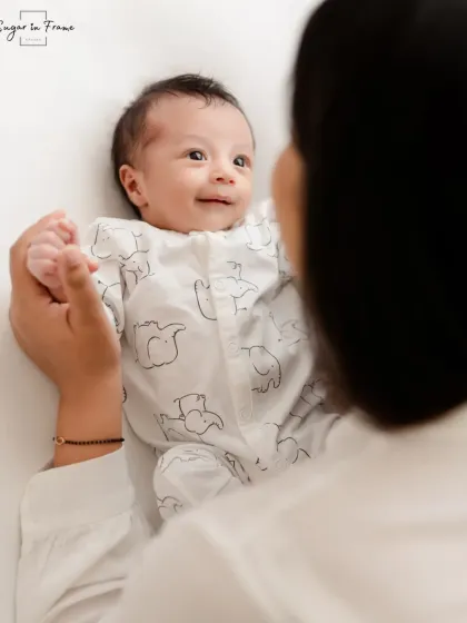 An adorable shot from the baby's perspective, looking up at their mother's smiling face. This captures the world through a newborn's eyes.