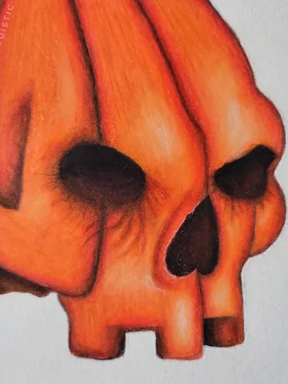 A detail shot of the skull's face, highlighting the deep shadows in the eye sockets.