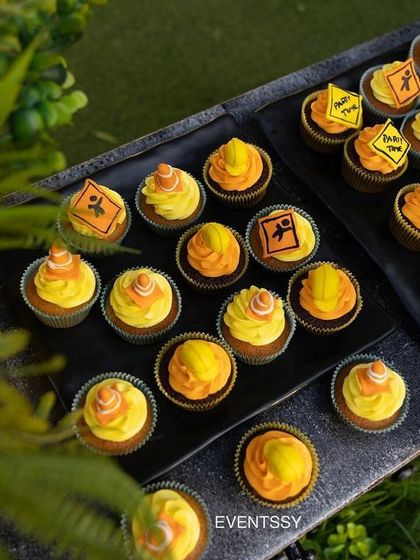 An overhead view of the themed cupcakes, each decorated with tiny construction signs.
