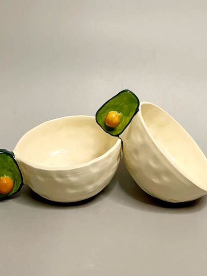 Sip in style with these handcrafted avocado ceramic mugs. The charming avocado design adds a fun, quirky twist to your tableware collection and elevates your morning routine.