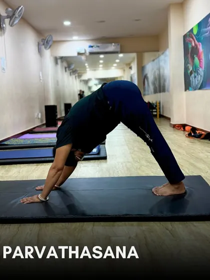Step 5: Parvathasana (Downward-Facing Dog). A foundational yoga pose that strengthens the entire body and helps to relieve stress.