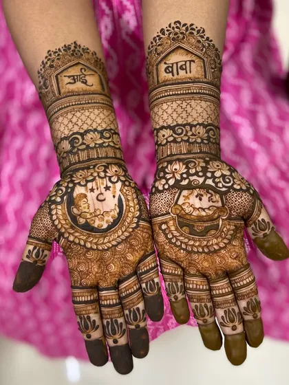 A baby shower mehendi design that honors the grandparents, with 'Aai' and 'Baba' written in beautiful script.