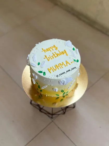 Another angle of the beautiful and artistic yellow floral cake.
