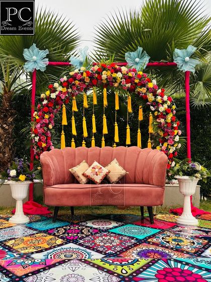 The same beautiful boho-chic Mehndi decor, captured from a straight-on angle, showcasing the symmetry and vibrant colors of the design.