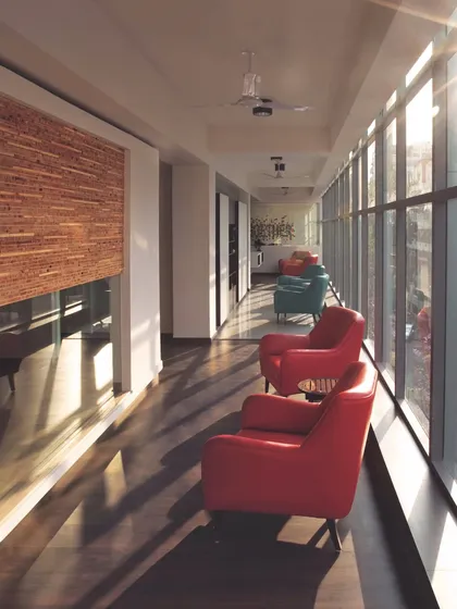 We love finding ways to bring sunlight deep into a building. At the White Canvas ad agency, we kept the main workspace open along the windows, creating these bright, informal seating areas for people to relax and connect.
