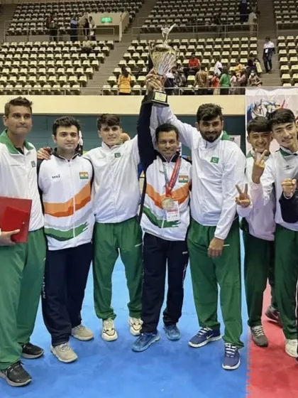 The Indian contingent celebrating a massive team victory at the South Asian Championship, holding the overall trophy high.