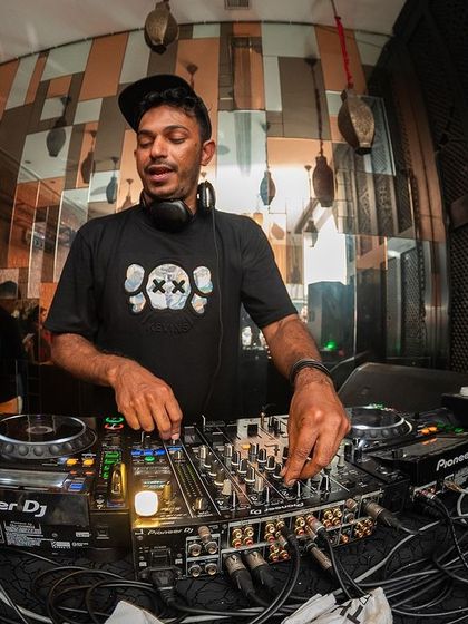 A focused shot of me working the Pioneer DJ mixer at i-Bar, a testament to the craft of DJing.