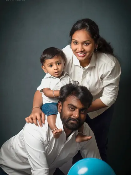 A playful family portrait with the little one sitting on dad's back. Capturing these fun and candid moments is what makes a session memorable.
