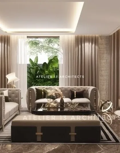 A formal seating arrangement with classic tufted sofas and a large, modern ottoman. The design uses a striped rug to ground the space, while large windows dressed with sheer curtains allow for soft, natural light.