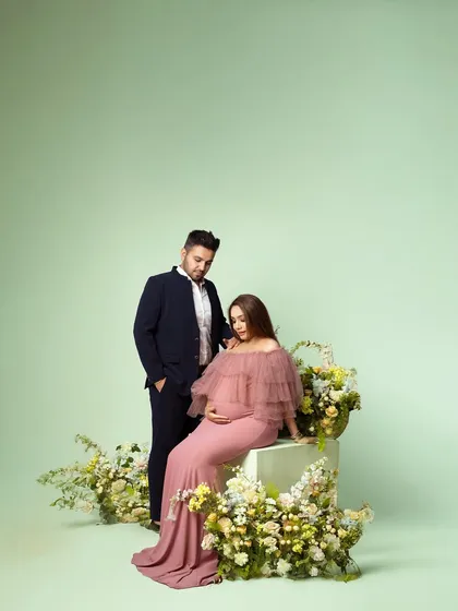 A soft, pastel-themed studio shoot with a floral setup. This style is perfect for a romantic and gentle aesthetic.