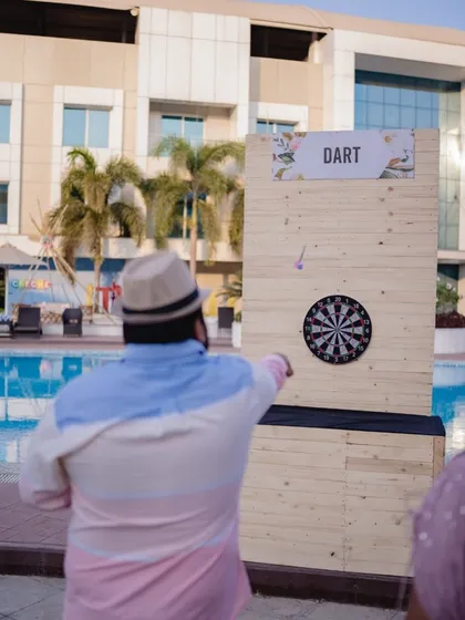 Let the games begin. I set up fun activity stations like this dartboard to keep guests entertained throughout the carnival.