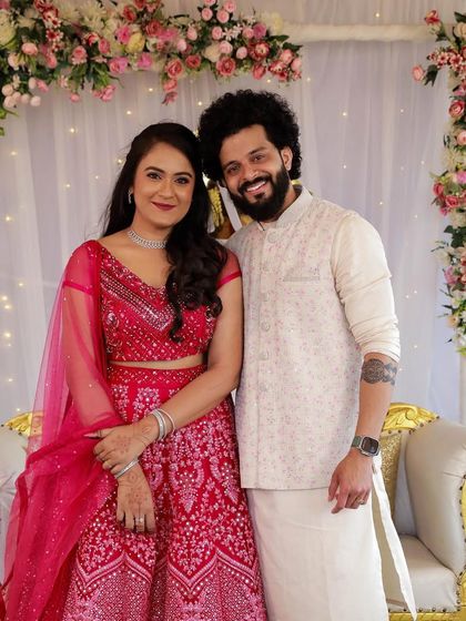 A radiant bride with her partner. Her simple yet elegant makeup for this pre-wedding event allows her natural happiness to be the focus.