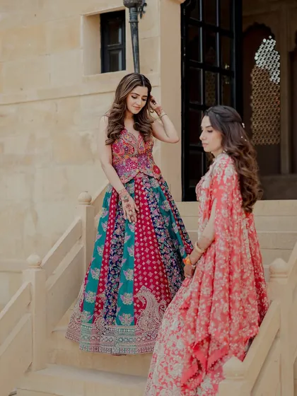 The Taaran lehenga set, worn here by Isha Multani, is a beautiful example of modern bridal wear. The vibrant, multi-tonal skirt paired with an intricately embroidered blouse creates a look that is joyful and unique.