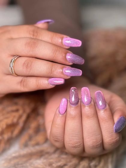 The full effect of the pink and purple glitter ombre. It's a playful and eye-catching look that's full of personality.