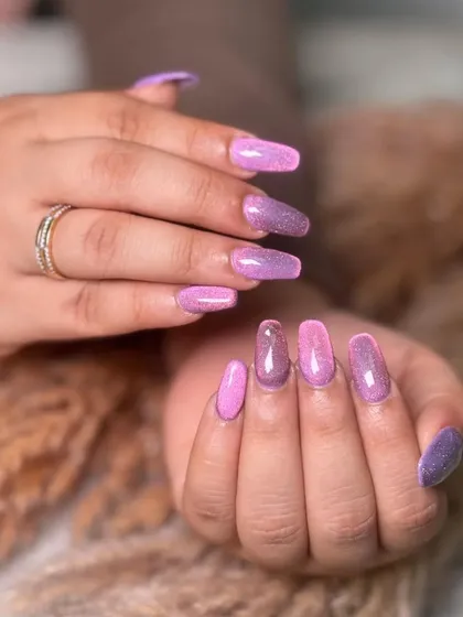 The full effect of the pink and purple glitter ombre. It's a playful and eye-catching look that's full of personality.