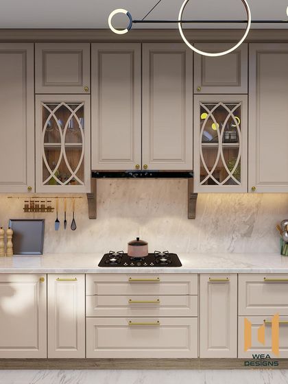 A neoclassical kitchen with a modern twist, featuring warm beige cabinets with classic moulding and intricate glass shutter designs.