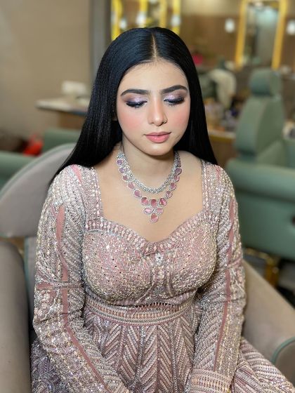 A close-up of the beautiful lilac and silver eye makeup. It's a modern and fresh take on engagement glam.