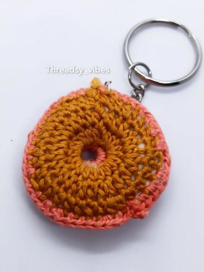 The back of my crochet donut keychain. Even the 'un-iced' side is neatly stitched to look like a real baked donut.