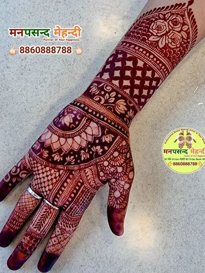 The rich, dark stain of this finished henna design is proof of my 100% color guarantee. The intricate floral and paisley patterns show beautifully against the skin.