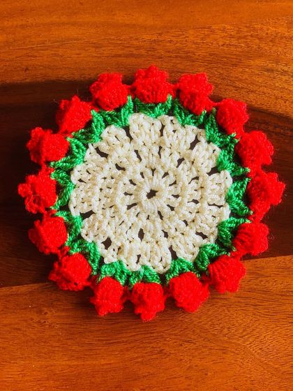 A small coaster with a red tulip border, designed to match the larger placemats.